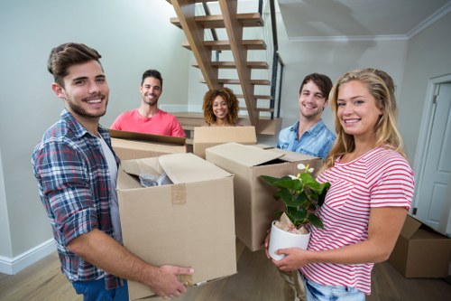 Man with van loading furniture for house removal