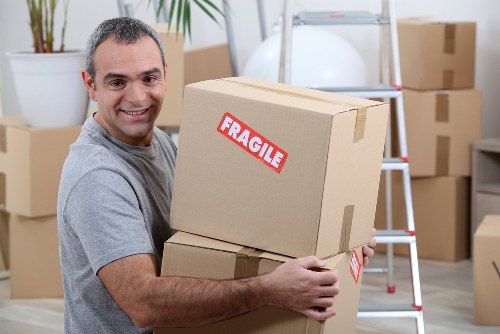 Man with van loading household items for a move