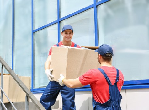 Movers carefully loading furniture into the van